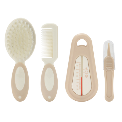 Une brosse douce pour bébé, un thermomètre pour l' eau de bain, pour les soins de la tête des nouveau-nés.